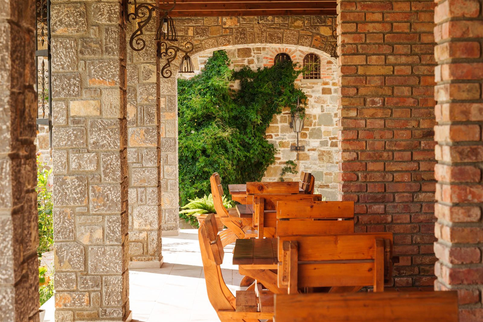 Stone terrace dining area under the veranda
